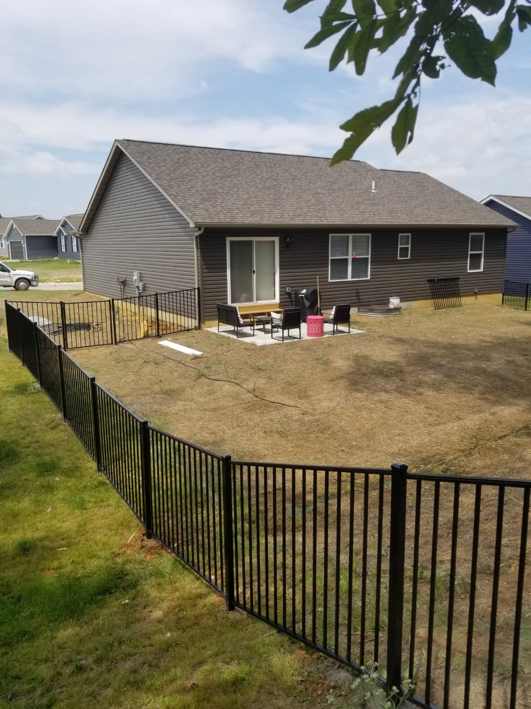 Black ornamental iron fence complete backyard enclosure, Ballwin MO