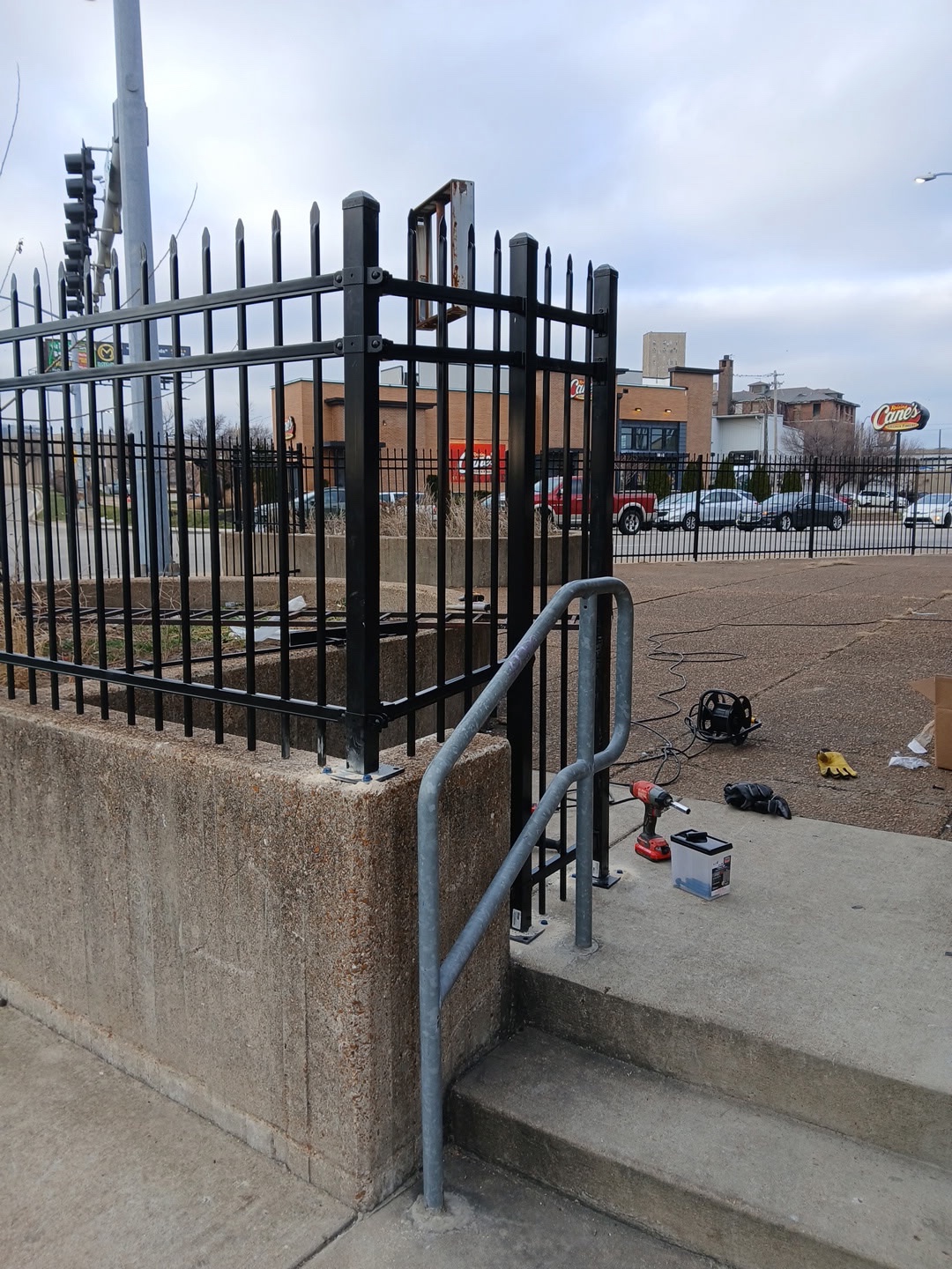 Black ornamental spear-top fence commercial installation