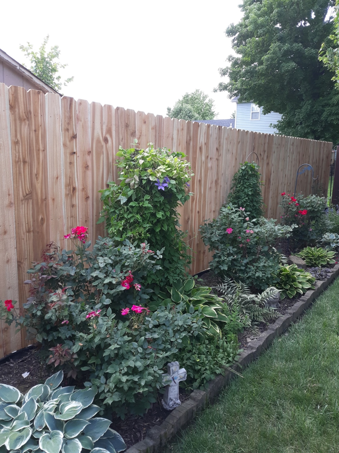 Cedar fence with flower garden bed installation, Ballwin MO