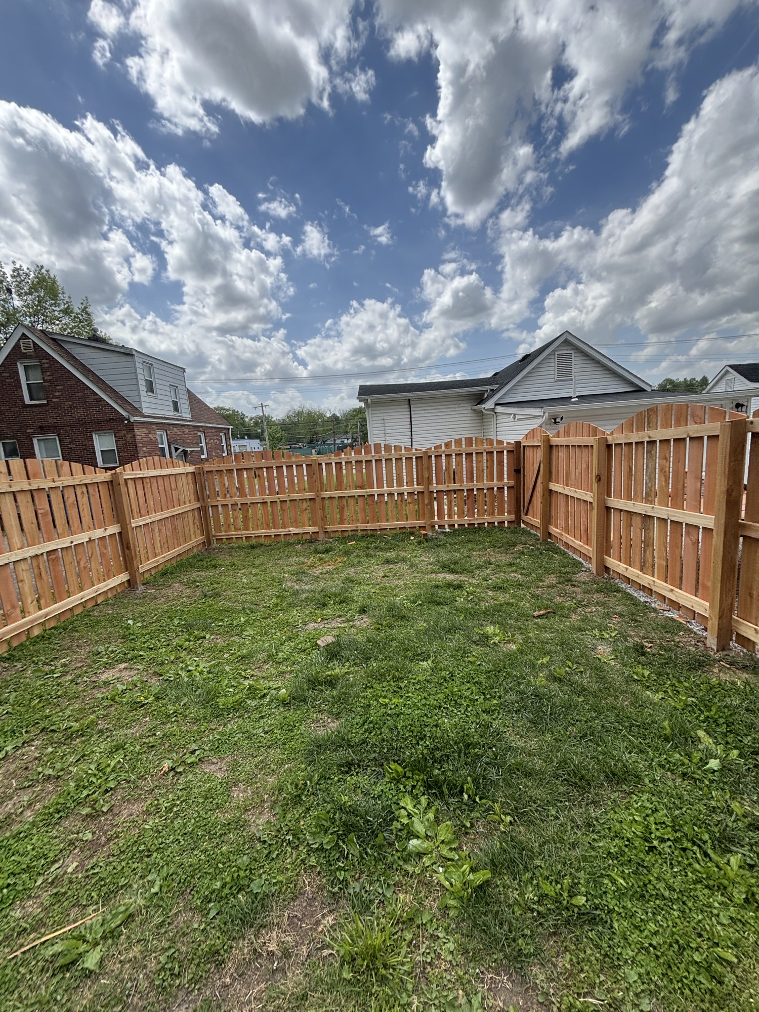 Cedar shadowbox fence with arched double gate