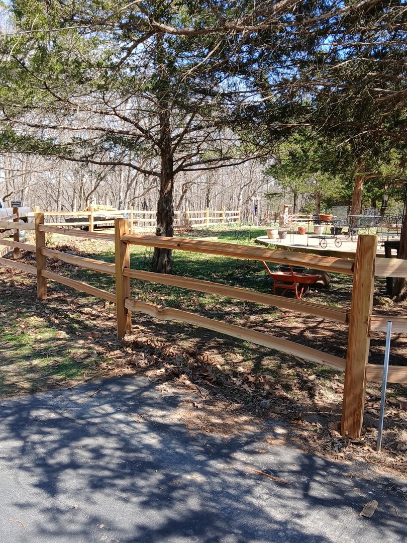 Split rail cedar fence on rural wooded property